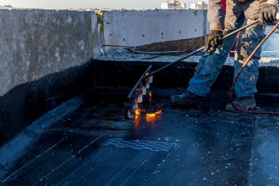 What To Expect During A Professional Tar Roof Torchdown Repair